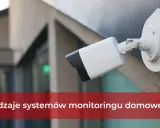 Kamera monitoringu na ścianie budynku. To przykład, co to jest monitoring, który zapewnia bezpieczeństwo.